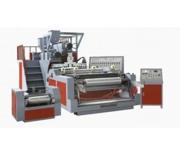 Industrial printing machine with multiple rollers and control panel.